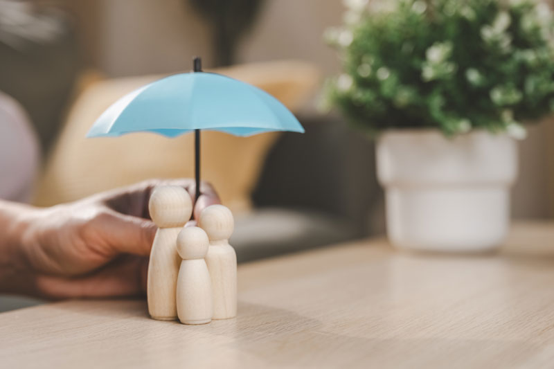 Holding Umbrella Over Family Holding Umbrella Over Family